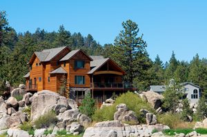 Mountain wooden cabin next to a lake homeowners insurance